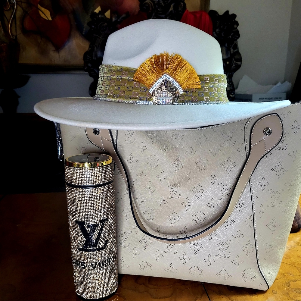 Ivory Fedora wide brim hat.